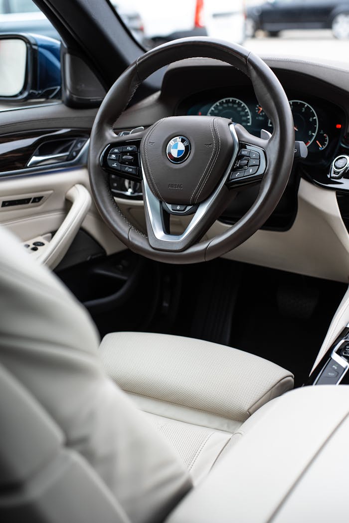 gallery-2 Explore the premium interior of a luxury BMW featuring elegant white leather seats and modern design.