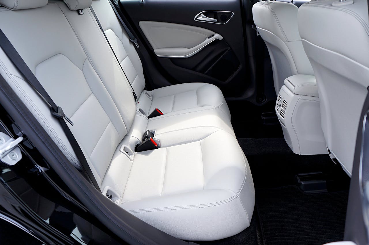 hero-img-02 Explore the modern and luxurious feel of a car's interior with pristine white leather seats.
