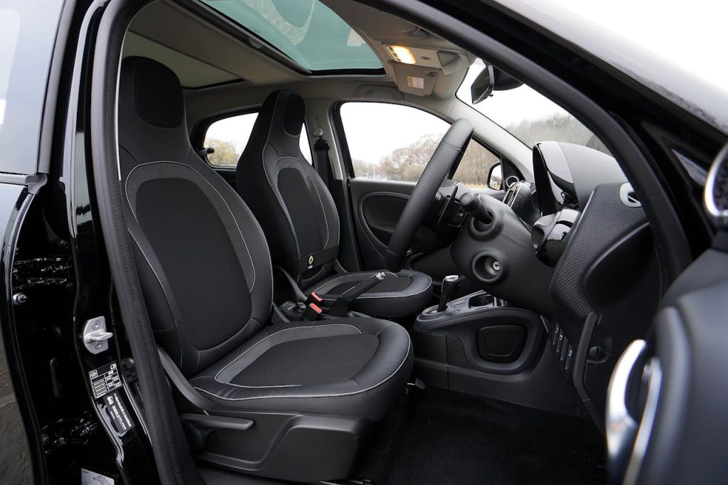 pexels photo 244819 Explore a modern car's interior featuring black leather seats and advanced technology.